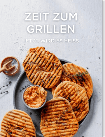 Grillbrot mit Oliven und Dip auf grauem Teller