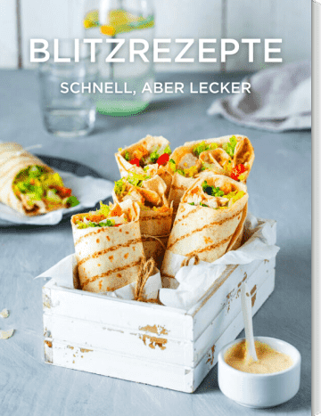 Wraps gefüllt mit Salat und Gemüse in weißer Box mit Dip in Schale